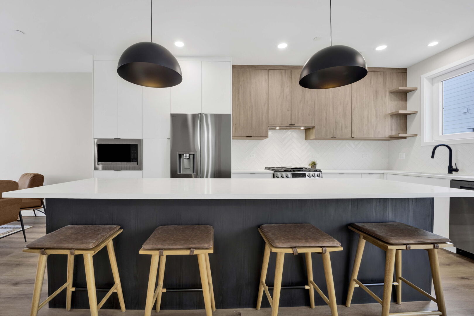 944 Beloit Avenue, Unit 4 Forest Park, IL 60130 - Photo 7 of 31 a kitchen with a cabinets and chairs in it