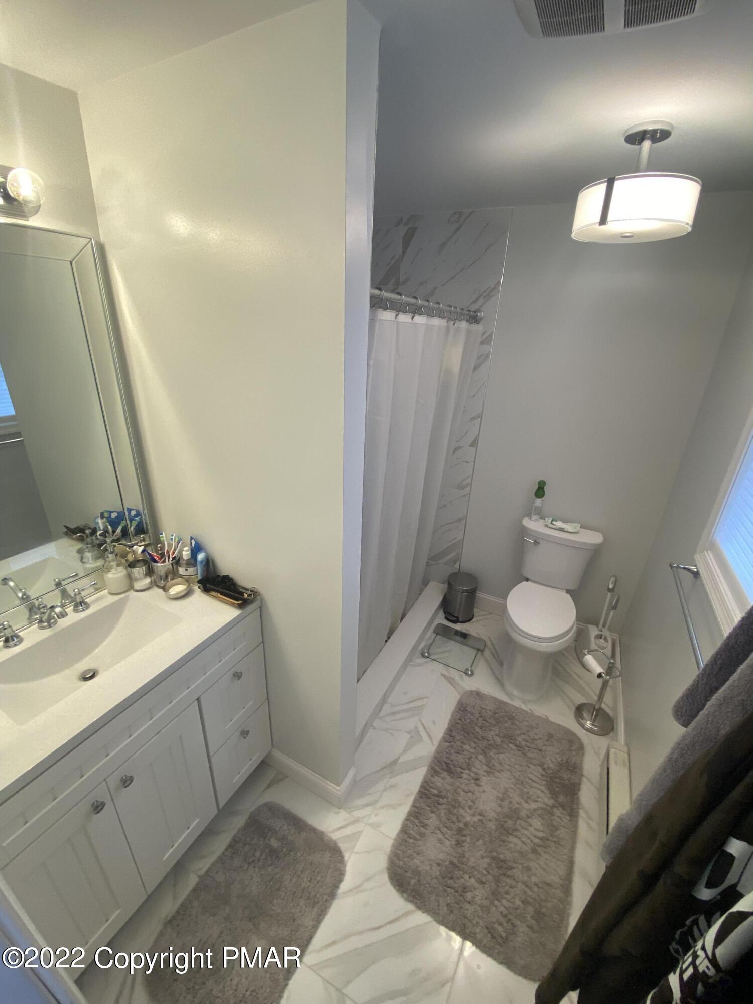 4698 Pine Ridge Drive West Bushkill, PA 18324 - Photo 11 of 17 a bathroom with a sink and a mirror