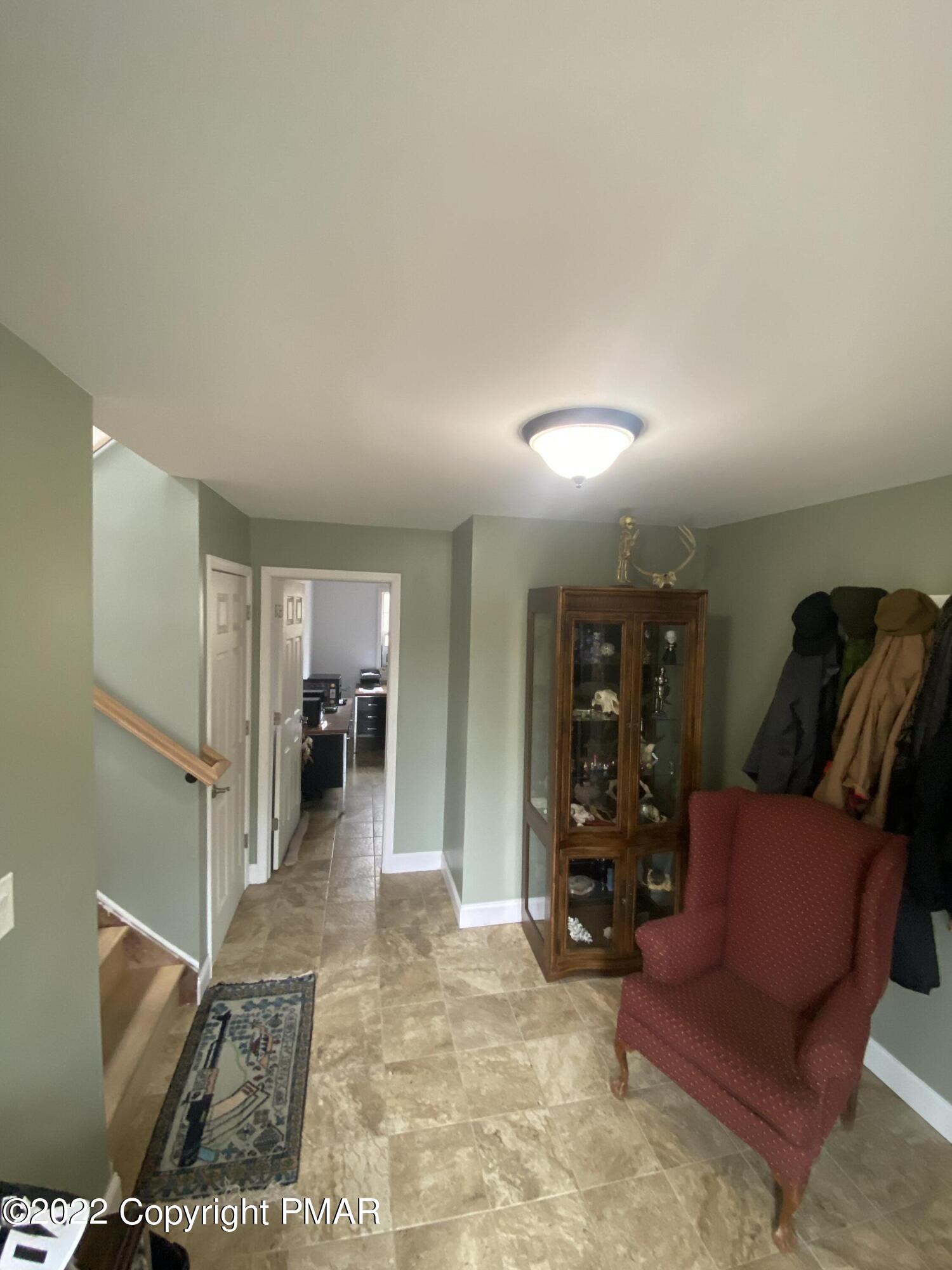 4698 Pine Ridge Drive West Bushkill, PA 18324 - Photo 12 of 17 a view of a livingroom with furniture and a flat screen tv