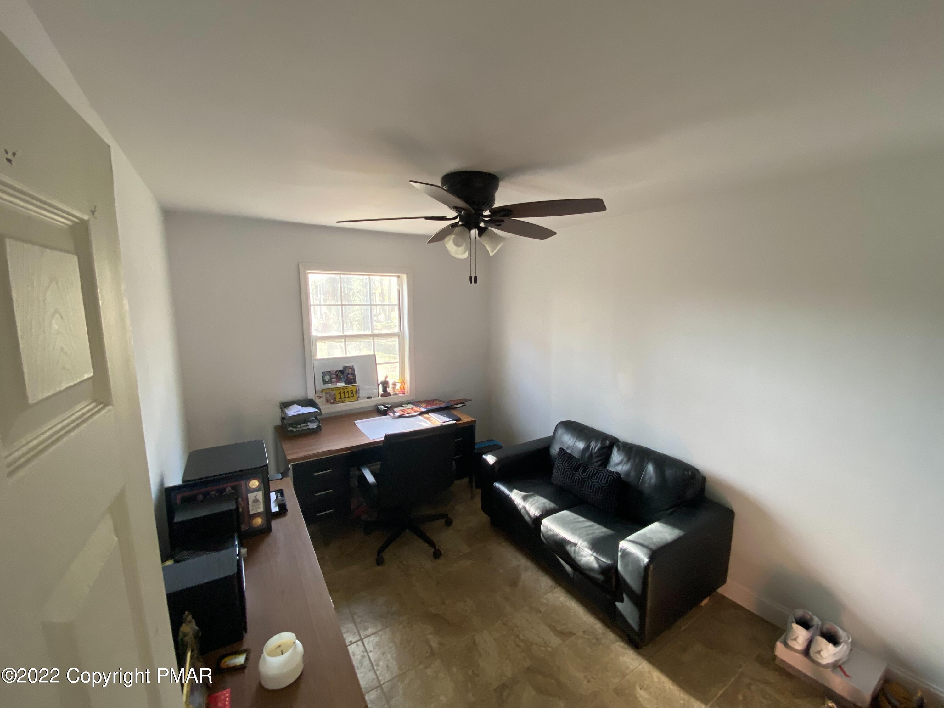 4698 Pine Ridge Drive West Bushkill, PA 18324 - Photo 15 of 17 a living room with furniture and a window