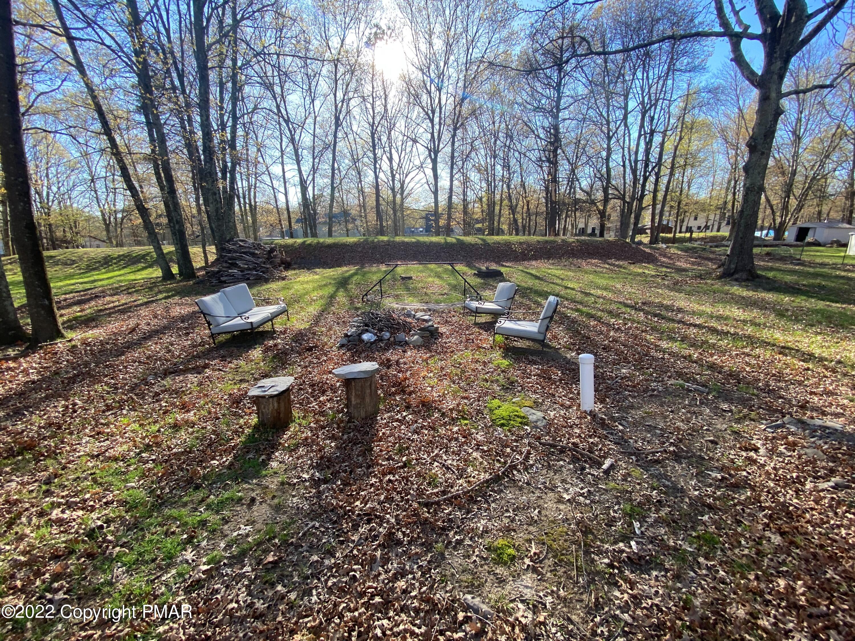 4698 Pine Ridge Drive West Bushkill, PA 18324 - Photo 16 of 17 a view of a yard with a tree