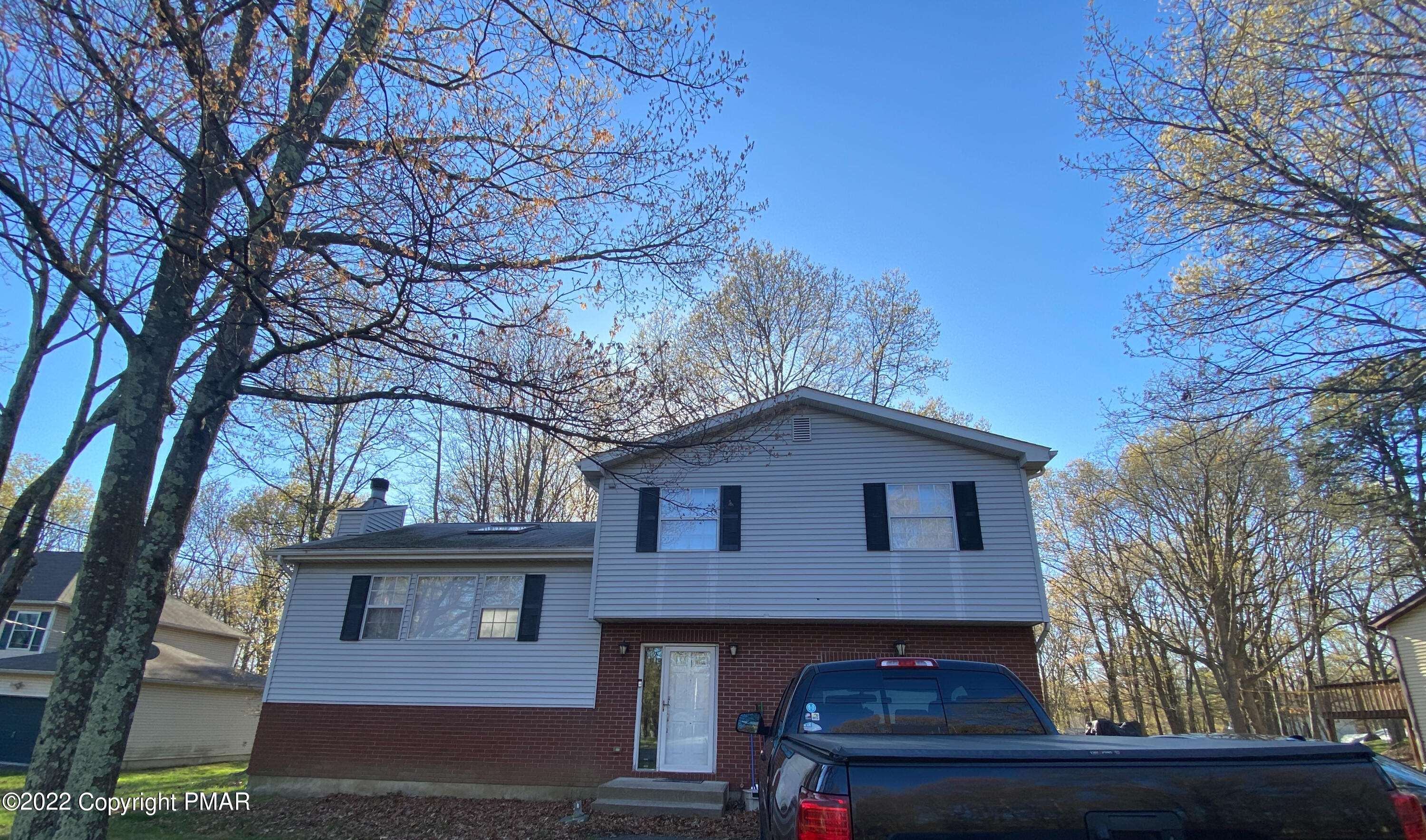4698 Pine Ridge Drive West Bushkill, PA 18324 - Photo 17 of 17 a front view of a house with a yard