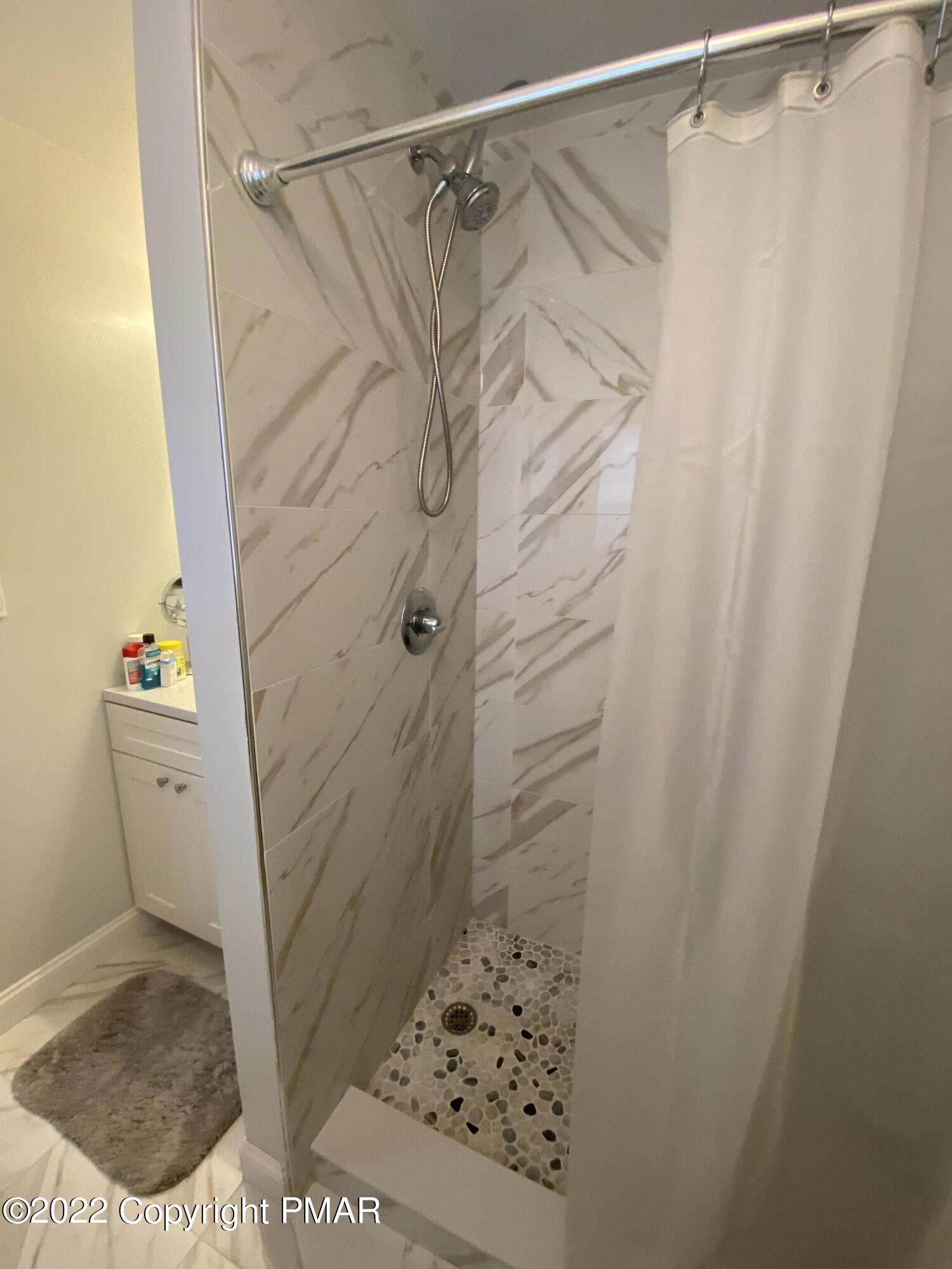 4698 Pine Ridge Drive West Bushkill, PA 18324 - Photo 10 of 17 a bathroom with a shower and a toilet