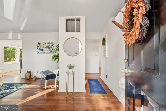 a view of a living room and wooden floor