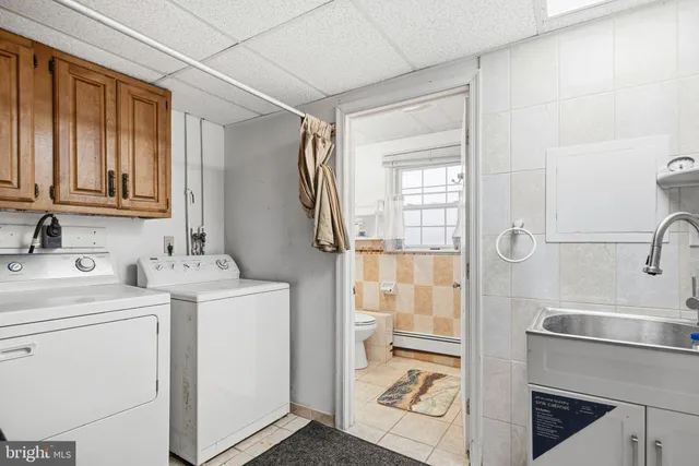 a view of bathroom with dual sinks