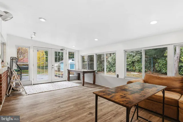 a living room with furniture and large window
