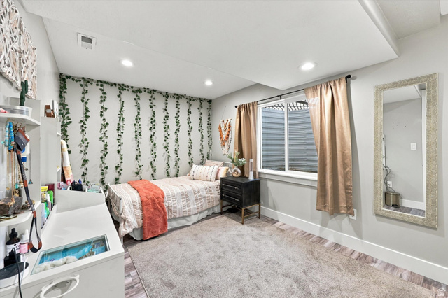 615 West 1870th Street South Payson, UT 84651 - Photo 18 of 31 Recessed ceiling lighting, window with light-filtering curtains, carpeted flooring, and a decorative wall treatment