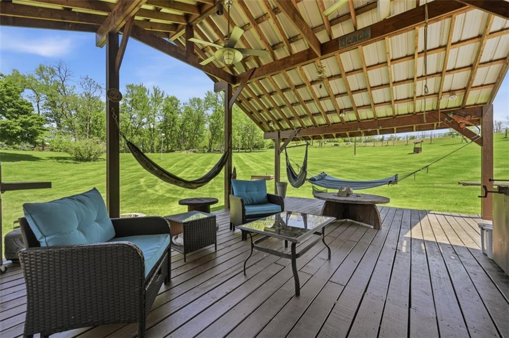2976 Henderson Road Washington, PA 15301 - Photo 31 of 50 a balcony with wooden floor and outdoor seating