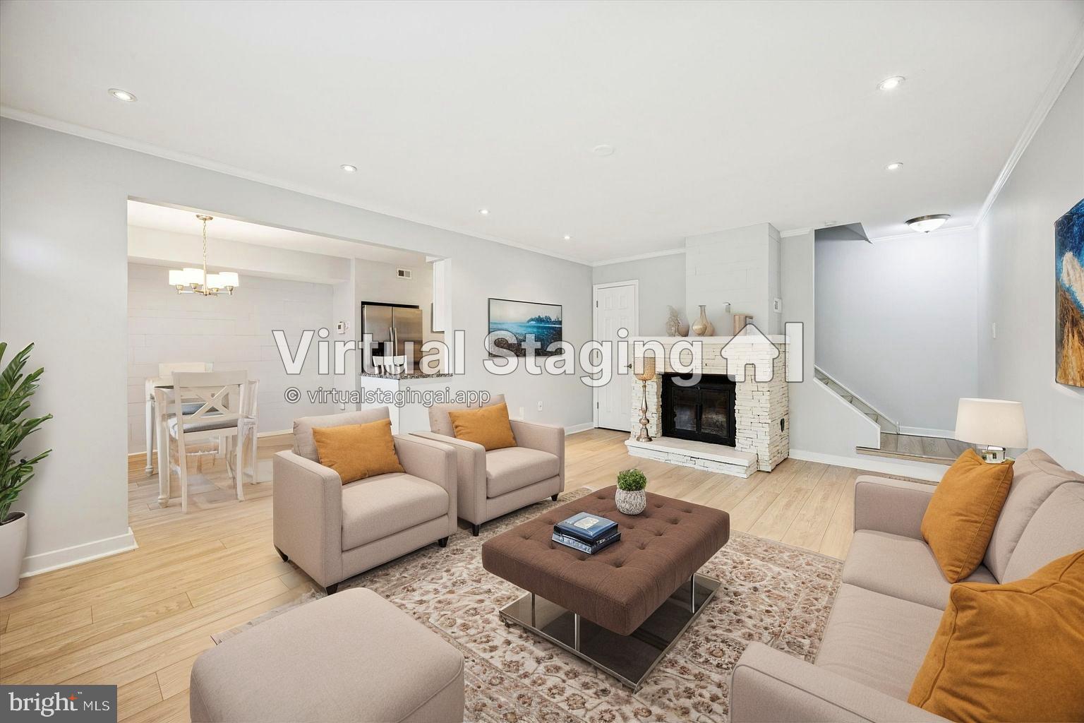 a living room with furniture a fireplace and a table
