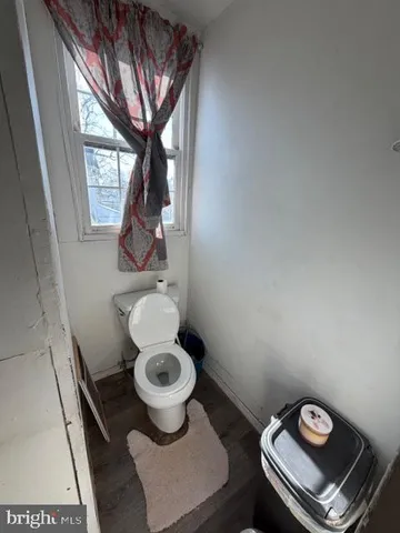 a bathroom with a toilet and a sink