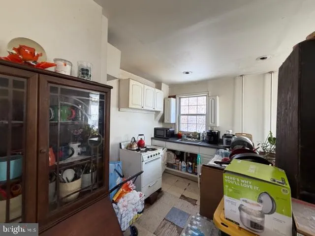 a room with furniture toys and a window