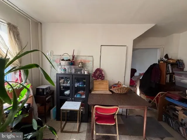 a view of a workspace with furniture and toys