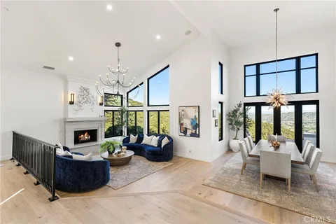 a large kitchen with stainless steel appliances granite countertop a stove and a sink with cabinets