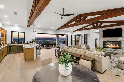 a view of a floor to ceiling window and dining room