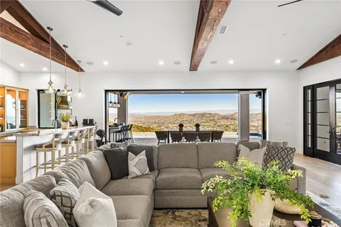 a outdoor space with patio furniture and a fireplace