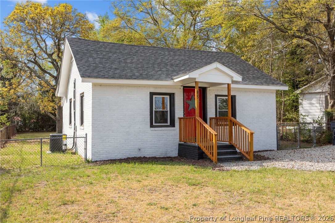 625 Eva Circle Spring Lake, NC 28390 - Photo 2 of 28 a view of a house with a yard balcony and wooden fence