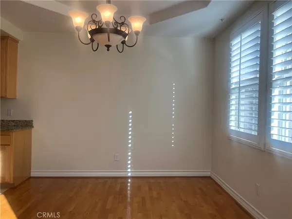 a view of room with window and hardwood floor
