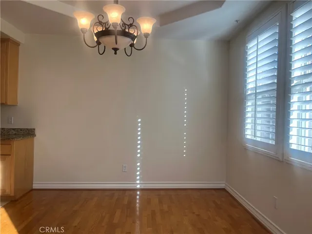 a view of room with window and hardwood floor