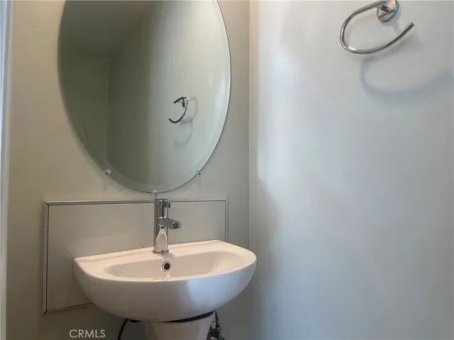 a bathroom with a sink and mirror