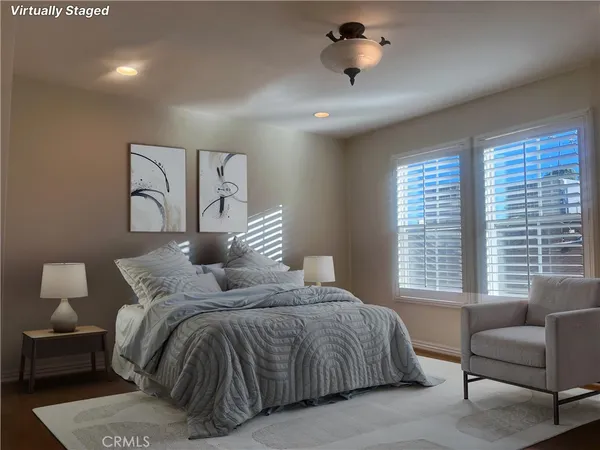 a bedroom with a bed and a couch