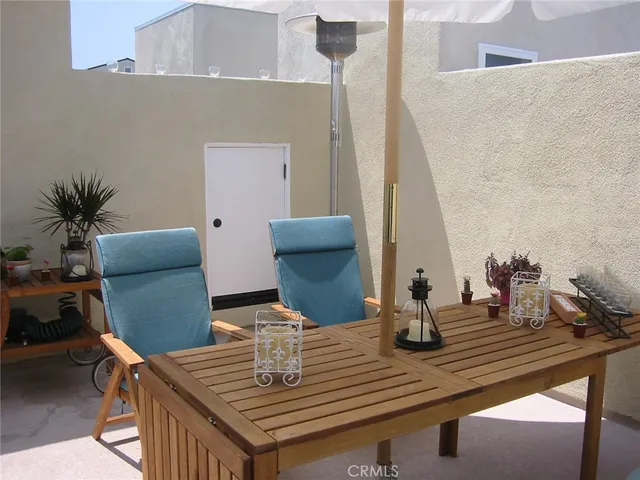 a view of table and chair with wooden floor