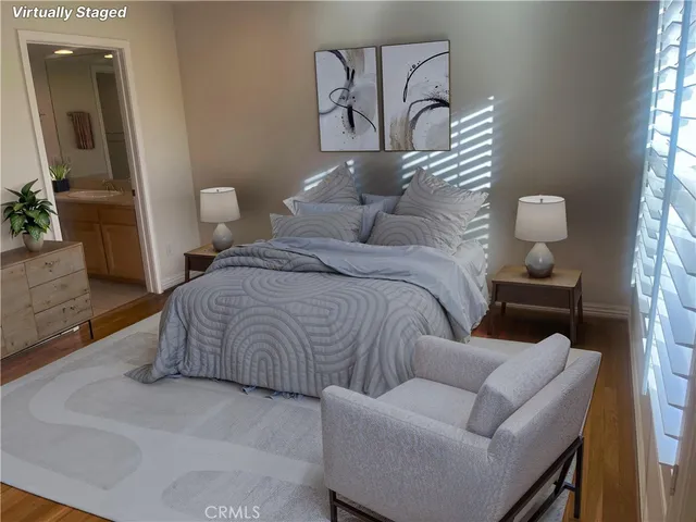 a bedroom with a bed and a couch