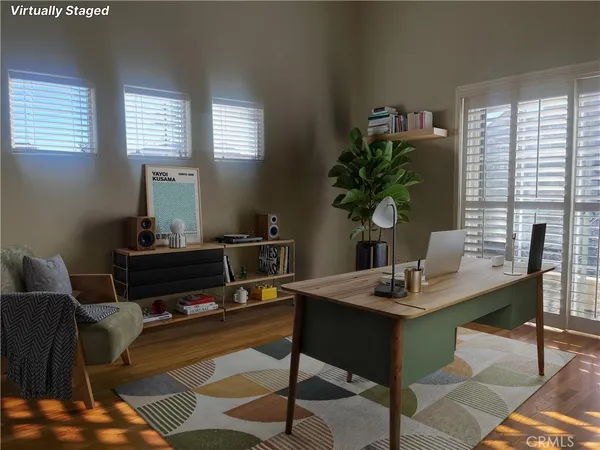 a workspace with furniture and a potted plant