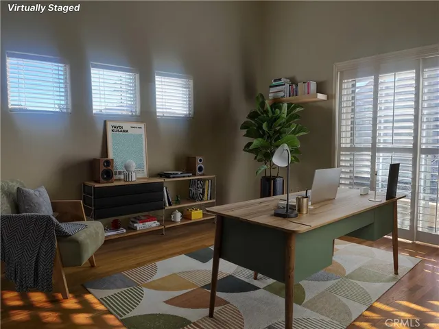 a workspace with furniture and a potted plant