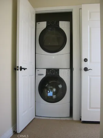 a close view of a utility and dryer and washer in a utility room