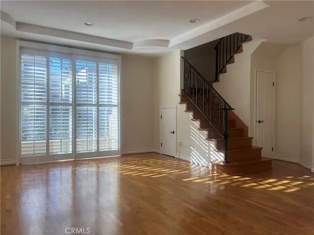 a view of entryway with wooden floor