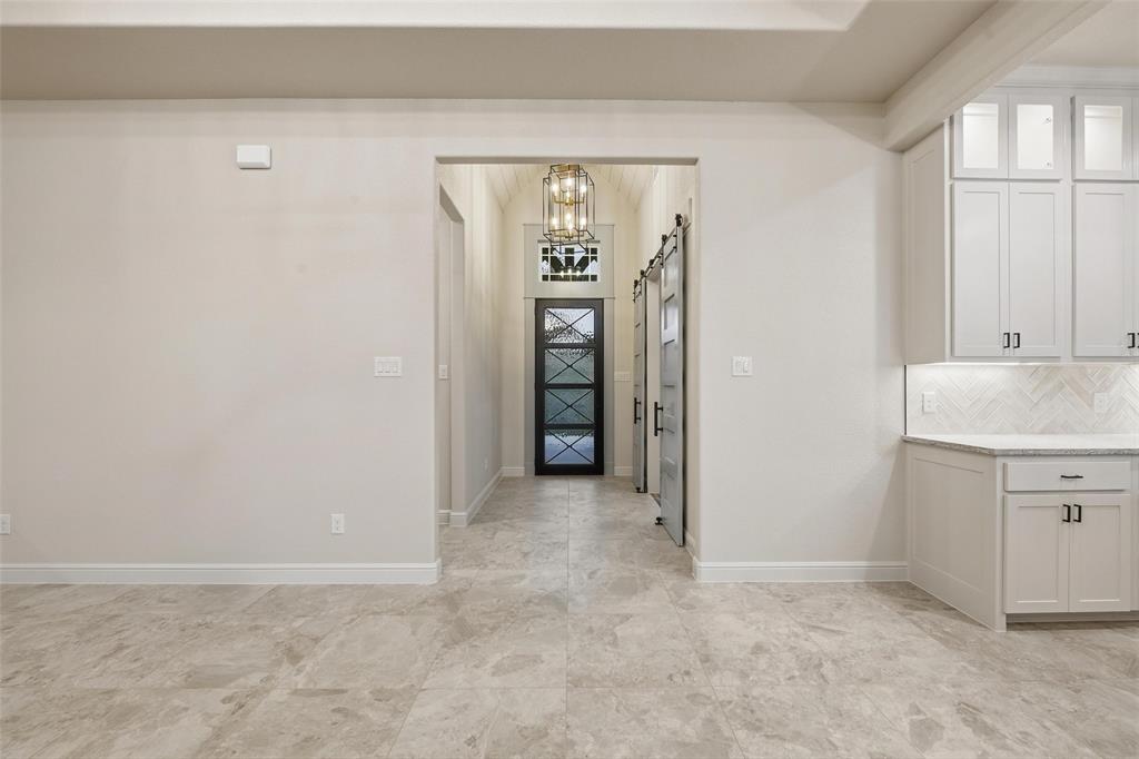 189 Rio Rancho Drive Decatur, TX 76234 - Photo 6 of 36 Foyer with baseboards and a chandelier