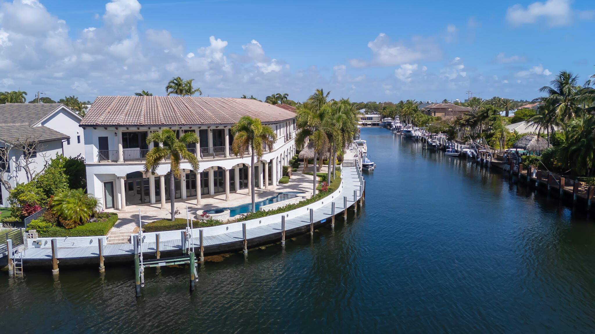 3700 Northeast 28th Avenue Lighthouse Point, FL 33064 - Photo 15 of 77 a view of a lake with a house swimming pool and outdoor seating