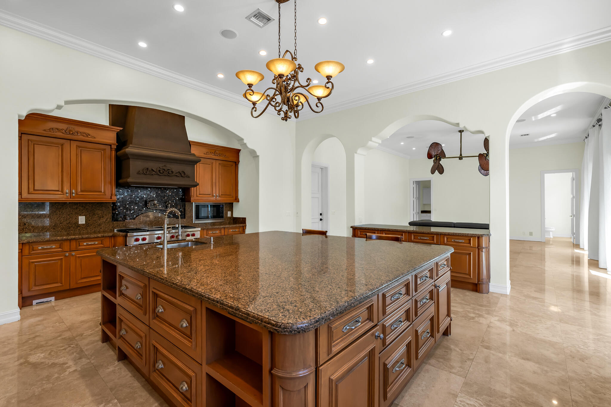 3700 Northeast 28th Avenue Lighthouse Point, FL 33064 - Photo 22 of 77 a kitchen with stainless steel appliances granite countertop a kitchen island a stove and a sink