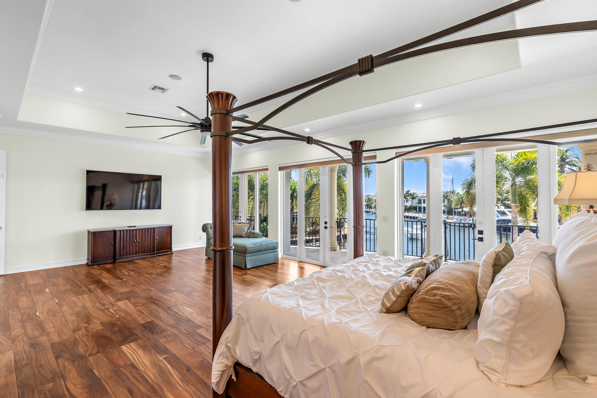 3700 Northeast 28th Avenue Lighthouse Point, FL 33064 - Photo 34 of 77 a bedroom with a large bed and a flat tv