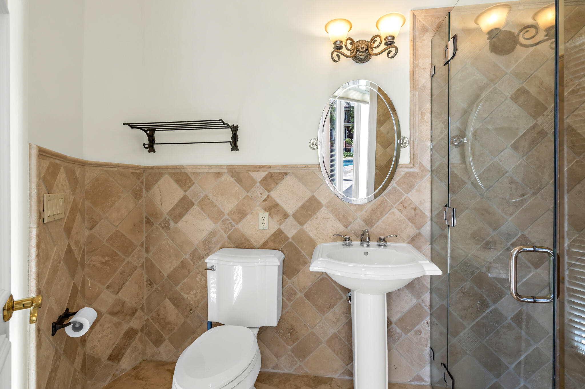 3700 Northeast 28th Avenue Lighthouse Point, FL 33064 - Photo 42 of 77 a bathroom with a toilet sink and mirror
