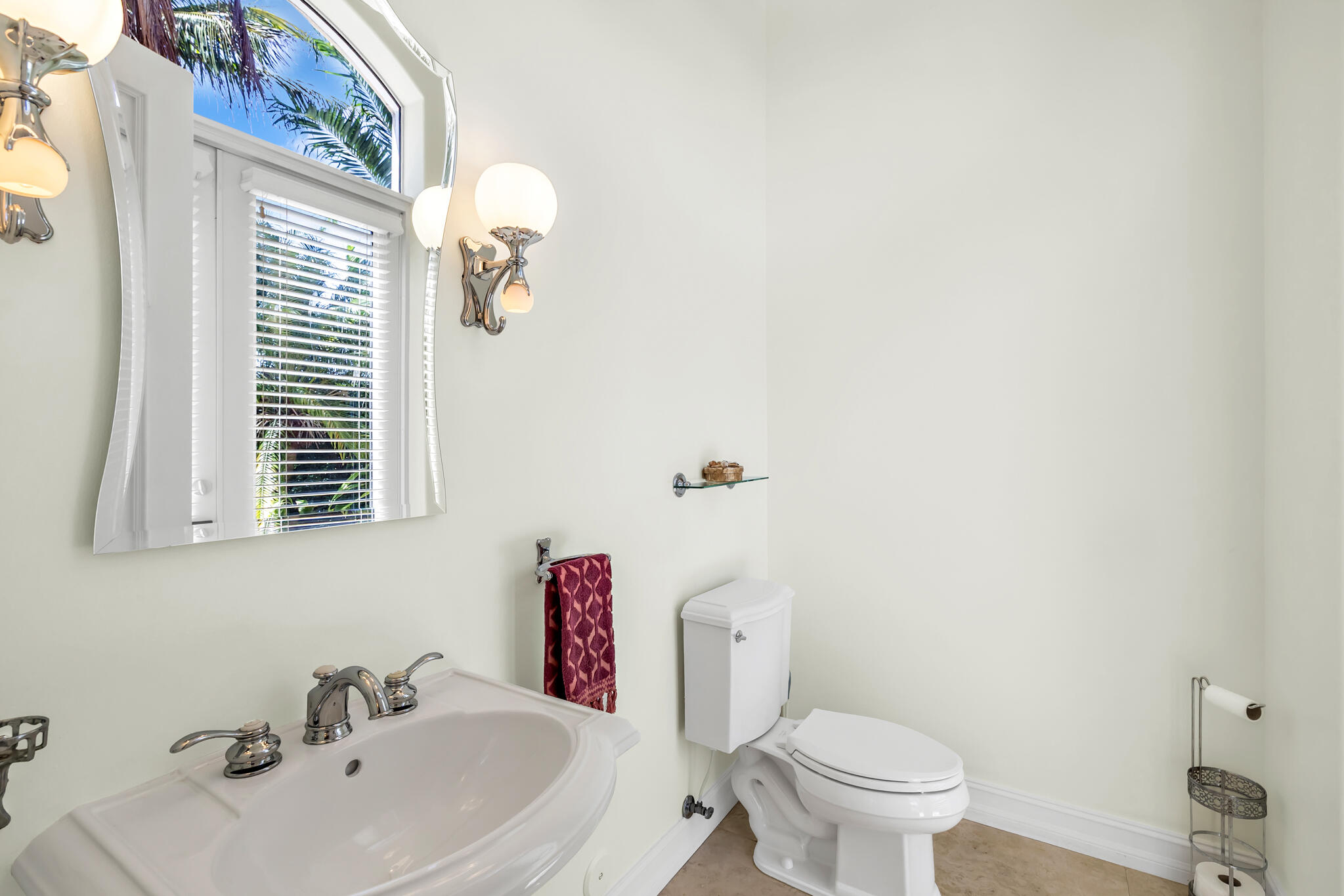 3700 Northeast 28th Avenue Lighthouse Point, FL 33064 - Photo 45 of 77 a bathroom with a sink mirror and toilet