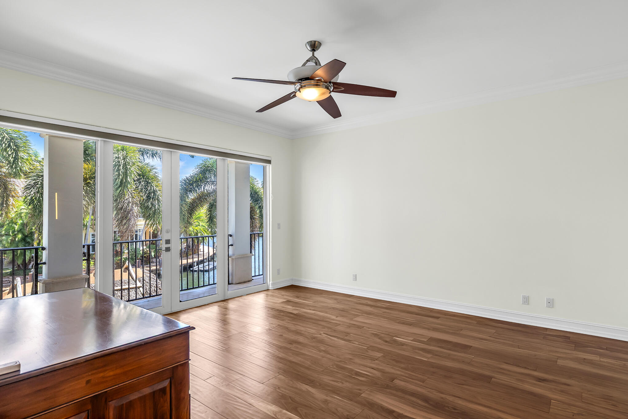3700 Northeast 28th Avenue Lighthouse Point, FL 33064 - Photo 55 of 77 a view of empty room with wooden floor and fan