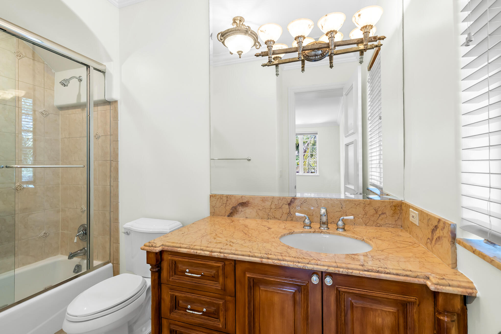 3700 Northeast 28th Avenue Lighthouse Point, FL 33064 - Photo 58 of 77 a bathroom with a granite countertop sink toilet and shower