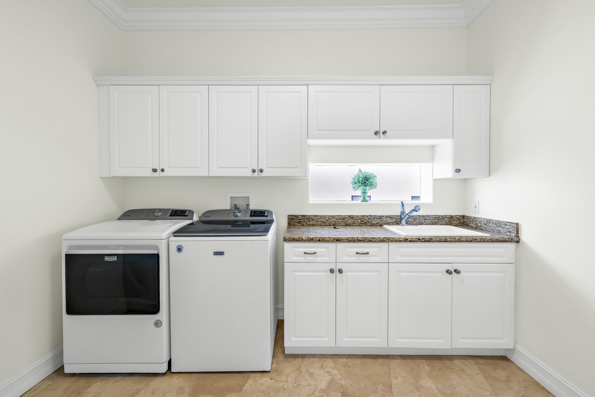 3700 Northeast 28th Avenue Lighthouse Point, FL 33064 - Photo 60 of 77 a kitchen with granite countertop white cabinets and white appliances
