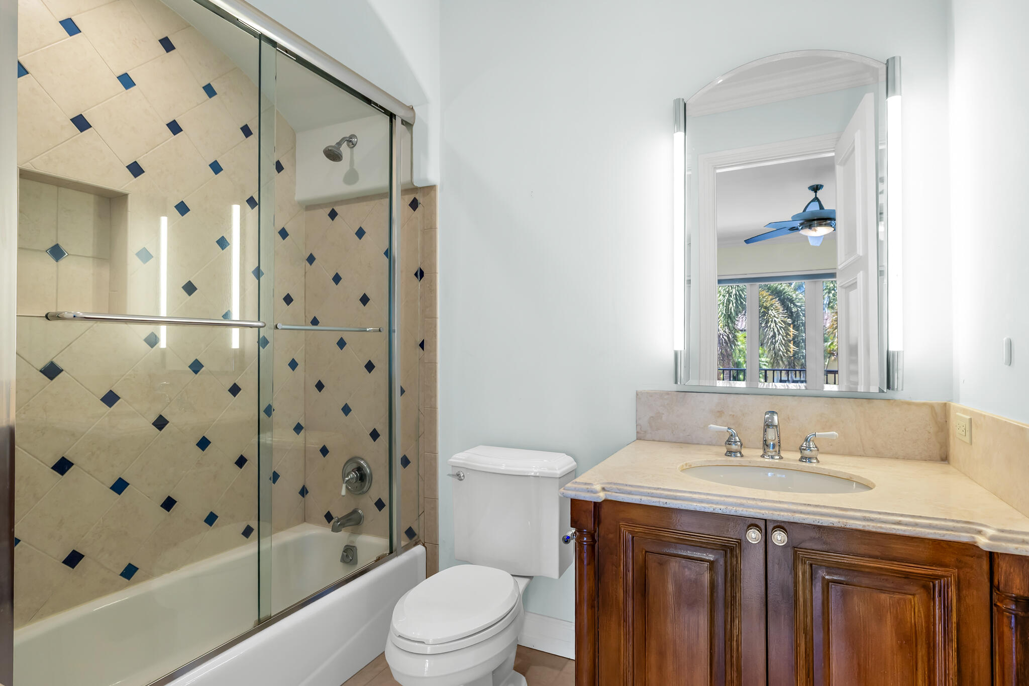 3700 Northeast 28th Avenue Lighthouse Point, FL 33064 - Photo 61 of 77 a bathroom with a granite countertop sink a toilet and shower