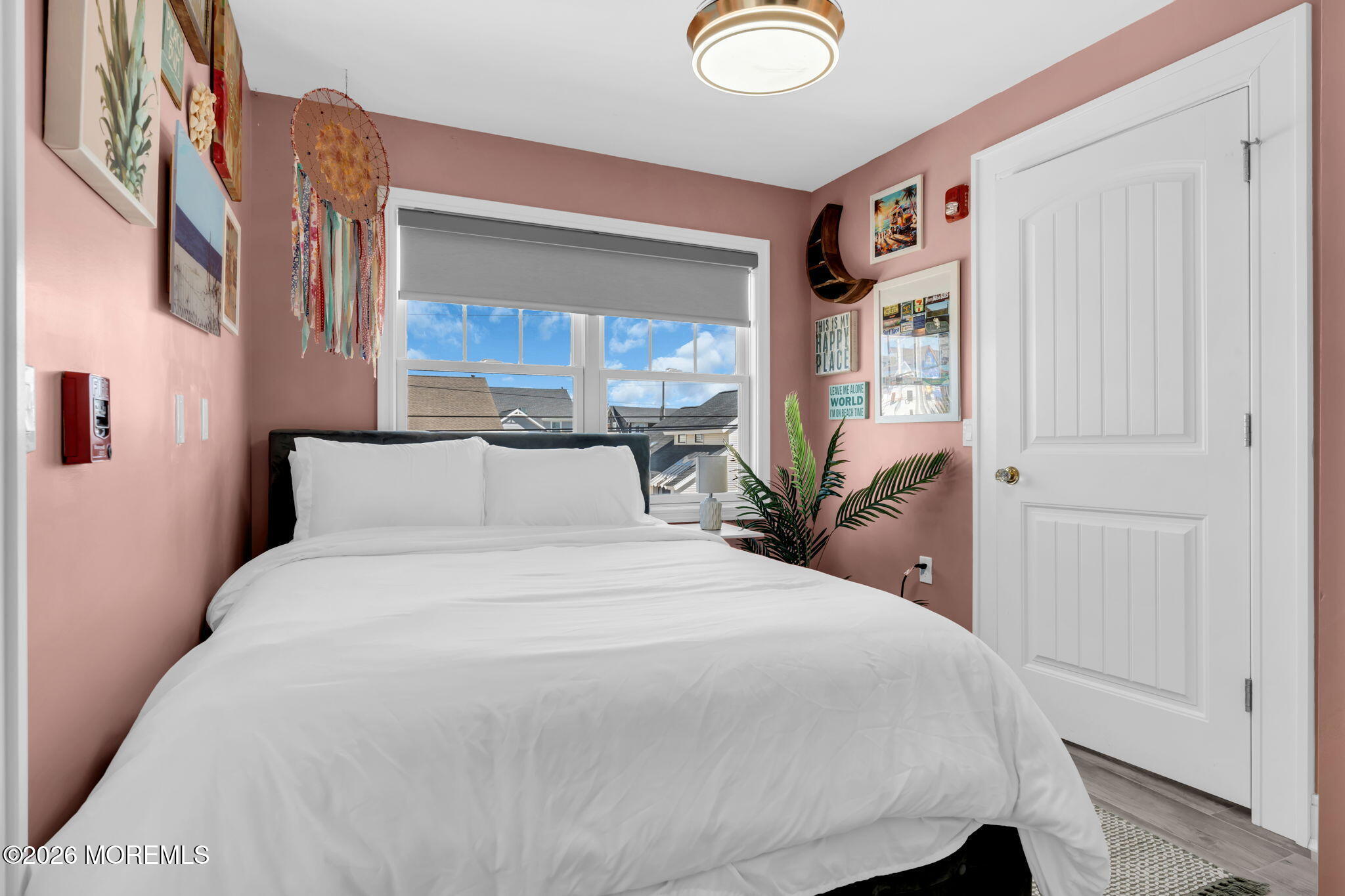 1301 Ocean Avenue, Unit 4 Point Pleasant Beach, NJ 08742 - Photo 8 of 13 a bedroom with a large bed and a window