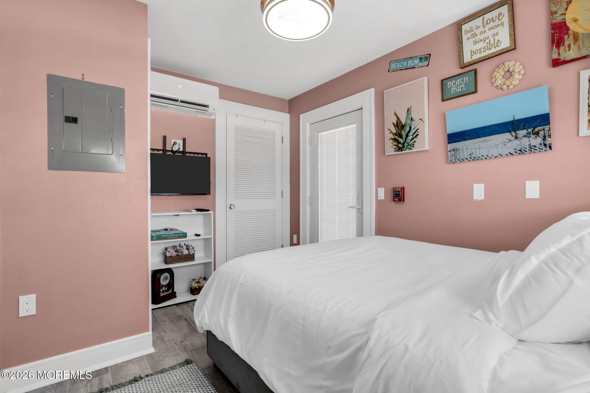 1301 Ocean Avenue, Unit 4 Point Pleasant Beach, NJ 08742 - Photo 9 of 13 a bedroom with a bed and a television