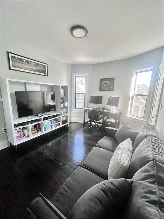 27 Armandine Street, Unit 3 Boston, MA 02124 - Photo 12 of 17 a living room with furniture and a flat screen tv