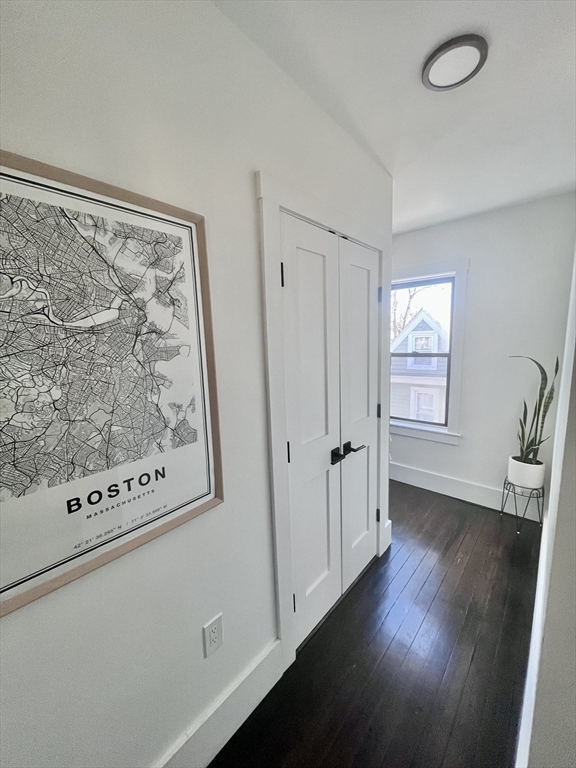 27 Armandine Street, Unit 3 Boston, MA 02124 - Photo 14 of 17 a view of a hallway with wooden floor and entryway