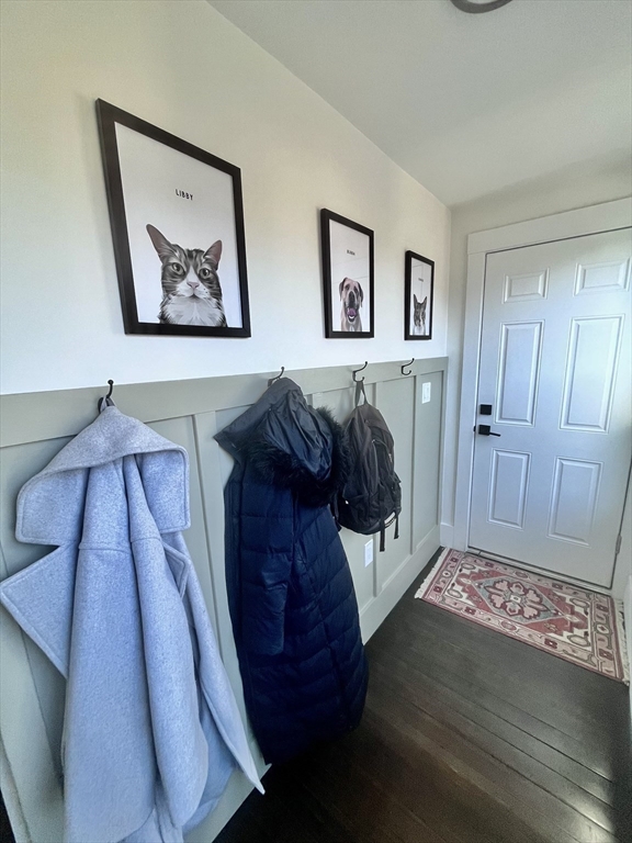 27 Armandine Street, Unit 3 Boston, MA 02124 - Photo 16 of 17 a view of a hallway with a wooden floor and a large window