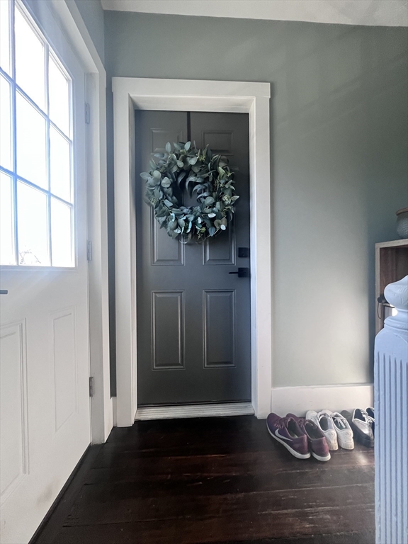27 Armandine Street, Unit 3 Boston, MA 02124 - Photo 2 of 17 a view of a hallway with wooden floor and a window