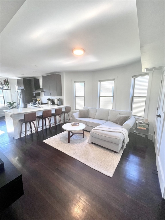 27 Armandine Street, Unit 3 Boston, MA 02124 - Photo 8 of 17 a living room with lots of furniture and a wooden floor