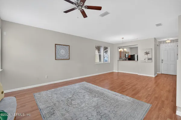 a kitchen with granite countertop a refrigerator stove and microwave