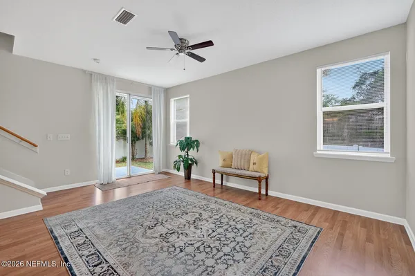 a kitchen with stainless steel appliances white cabinets and a stove top oven