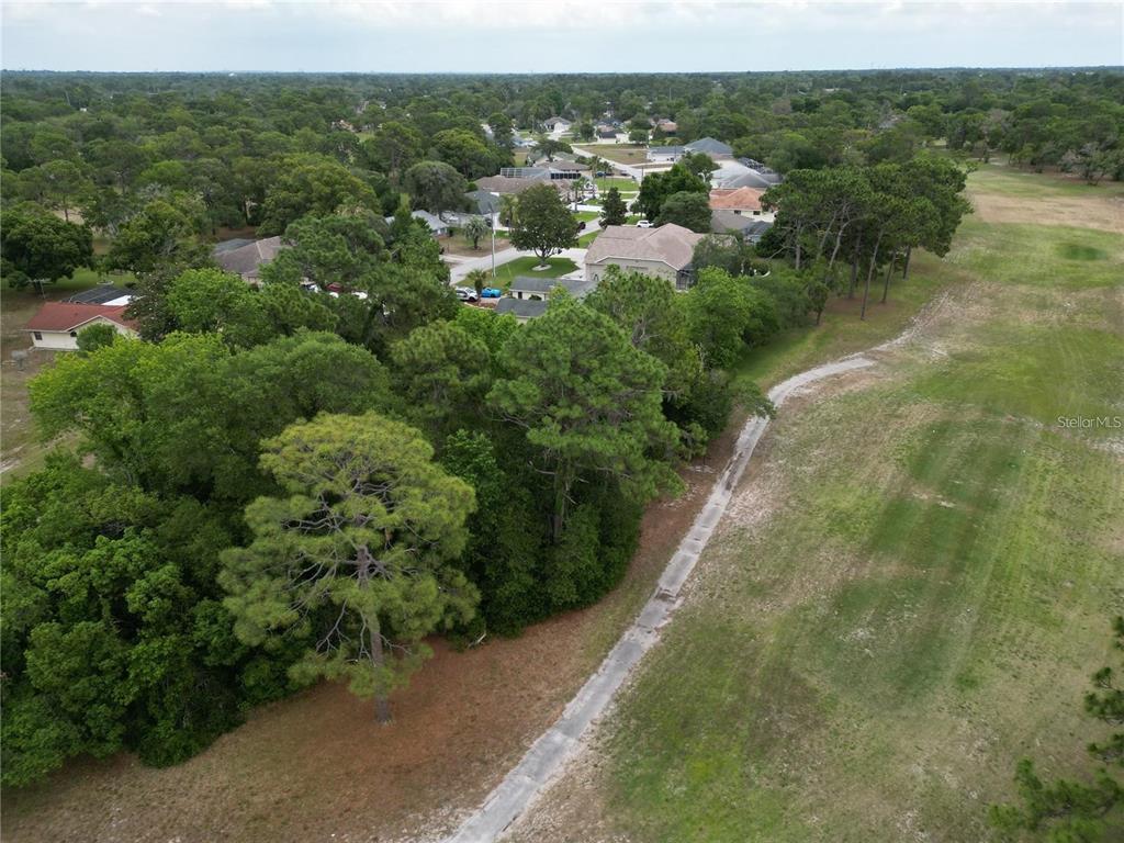 Loretto St Spring Hill Spring Hill, FL 34606 - Photo 3 of 7 a view of a lake with a city